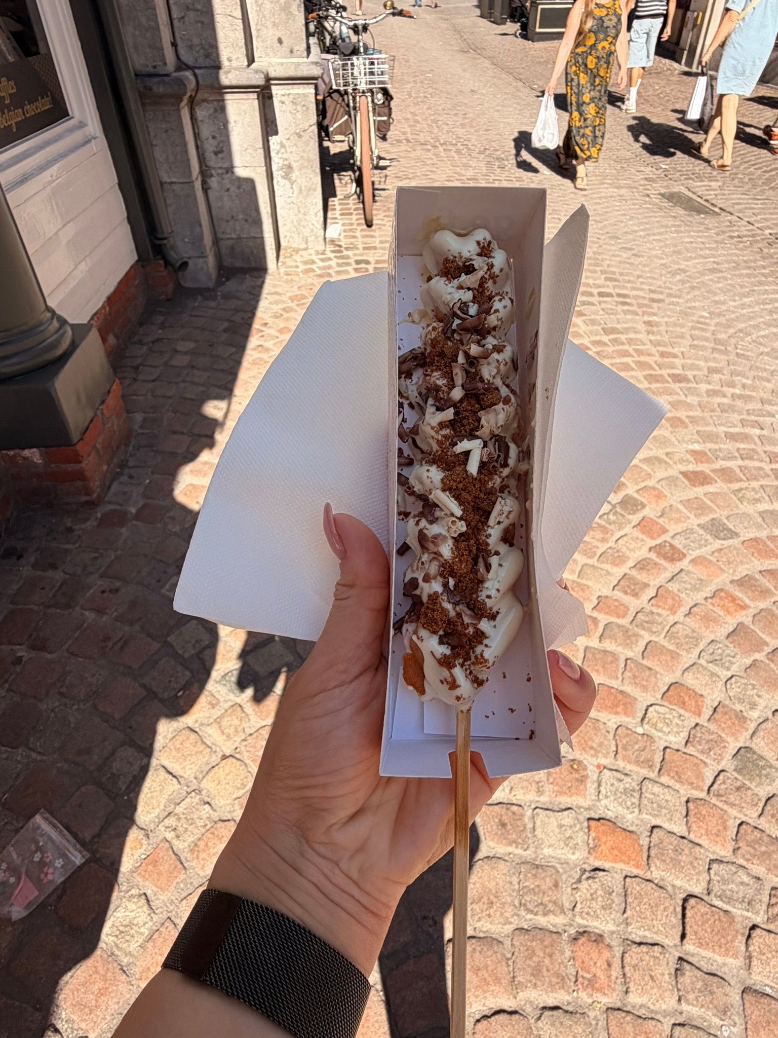Chocolate covered waffle, eaten walking, as it should be